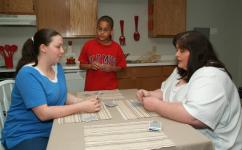 Stephanie Williams with her family in a Carpenter Estates apartment. 